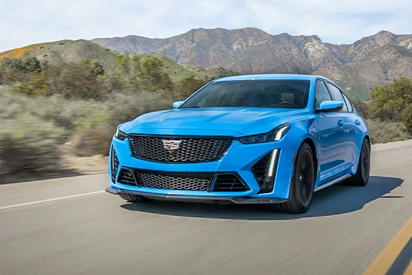 Blue Cadillac CT5 on highway