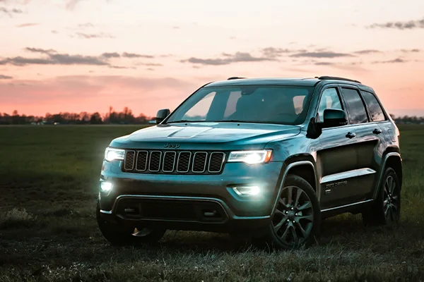 Jeep Cherokee SUV parked in grass
