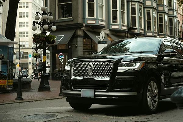 Black Lincoln SUV on city street
