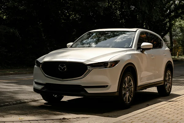 White Mazda SUV driving