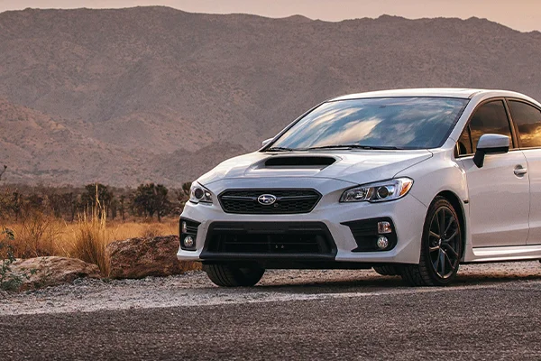 White Subaru WRX on road