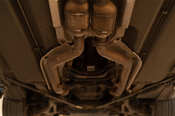 Dual catalytic converters on underside of vehicle 