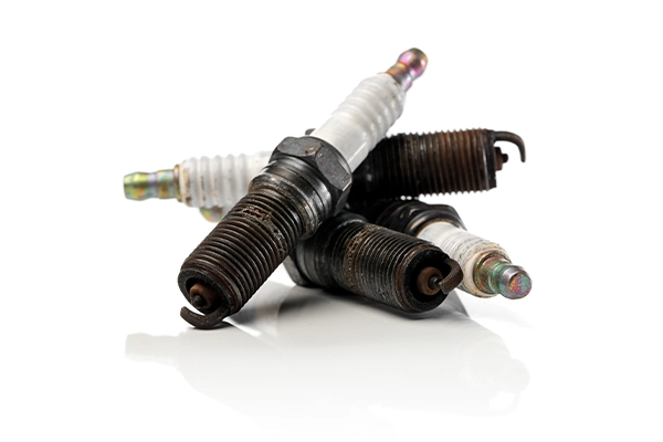 Used spark plugs on isolated background